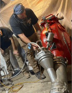 Worker performing a sewer relining