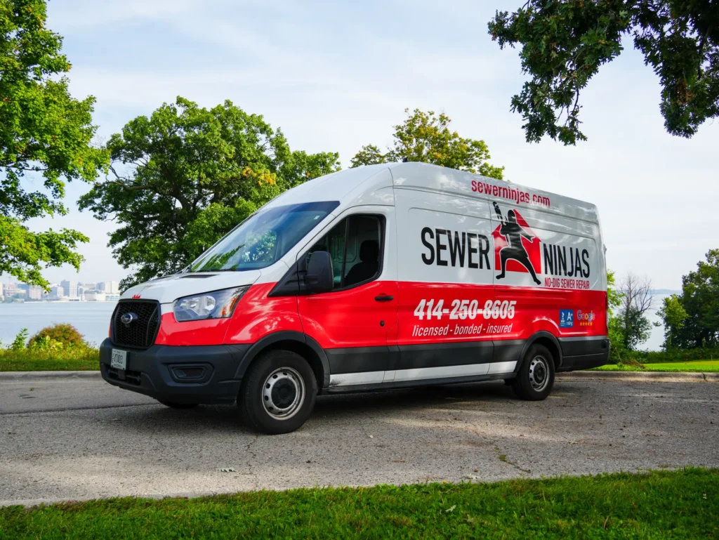 sewer ninjas company van parked next to a lake in Madison, Wi